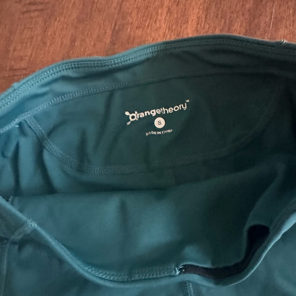 Orangetheory Teal Bike Shorts with Orange Accents and Socks - Picture 3 of 4